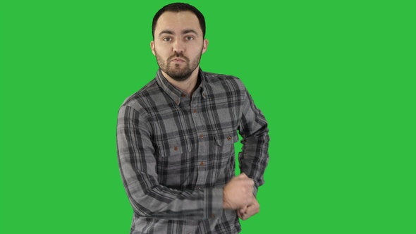 Casual man walking and dancing on a Green Screen, Chroma Key.