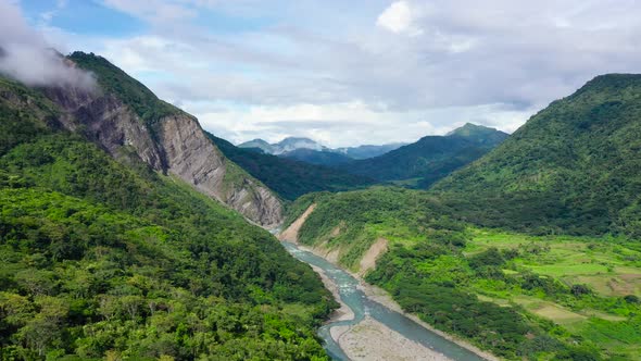 Mountains Covered By Rainforest, Aerial View. River in a Mountain Gorge.