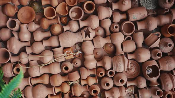 a large number of ceramic dishes and jugs on the plane, slow motion video