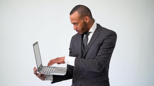 Professional African-american Business Man Holding Laptop Computer