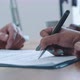 Close up of hands of agent and client signing contract - VideoHive Item for Sale