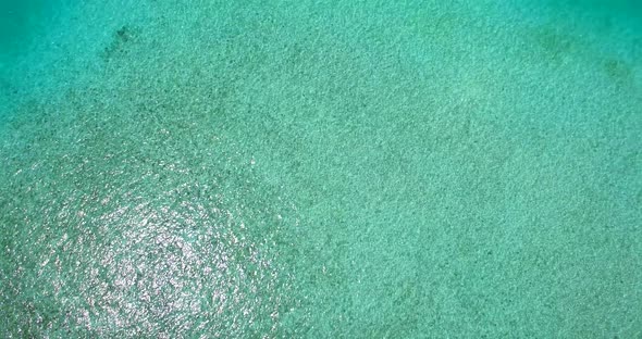 Aerial drone view of a scenic tropical island in the Maldives.