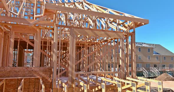 New Stick Built Building View Framing of Beams on New Home Under Construction