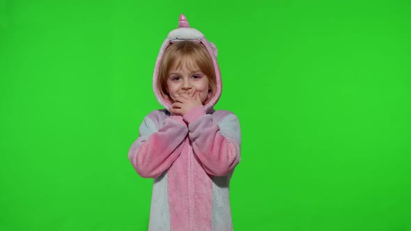 Amazed Astonished Young Kid Girl in Unicorn Costume Pajamas Showing Wow Reaction Perfect Surprise