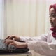 an Asian little girl wearing red hijab typing on laptop with headphone - VideoHive Item for Sale