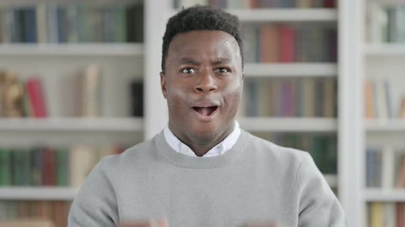 Portrait of Excited African Man Celebrating Success