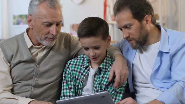 Family Using Tablet Together at Home, Birthday Gift for Little Boy, Generation