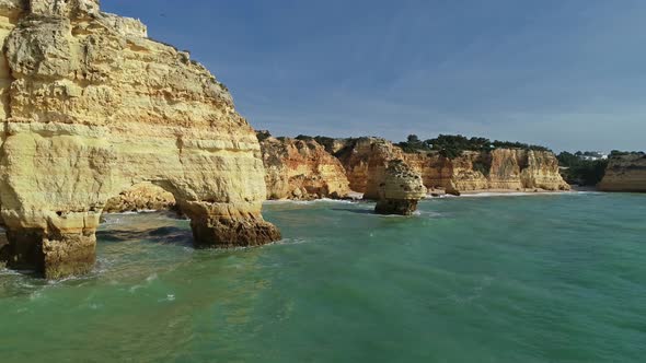 Aerial View on Rock Cliffs and Waves in Portugal