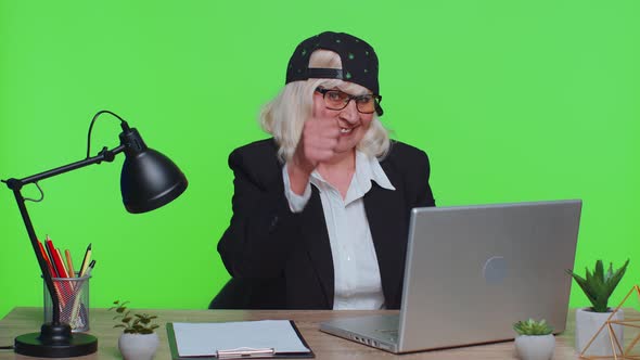 Senior Business Woman Raises Thumbs Up Agrees Approve Likes Good News Using Laptop at Office