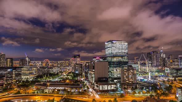 Melbourne Australia Victoria night timelapse rooftop view of big sky scrapers roads and Melbourne st