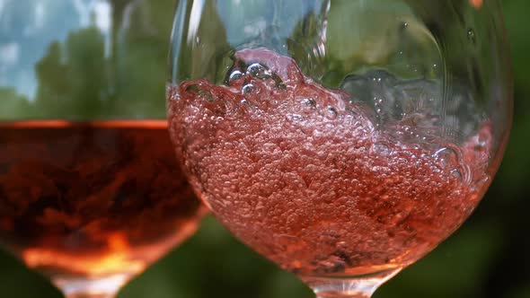 980028 Pink Wine being poured into Glass, Slow motion