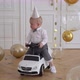 Infant Child Sitting in Electric White Car - VideoHive Item for Sale