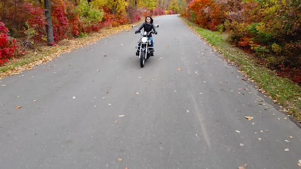 Aerial view of young woman on a motorcycle