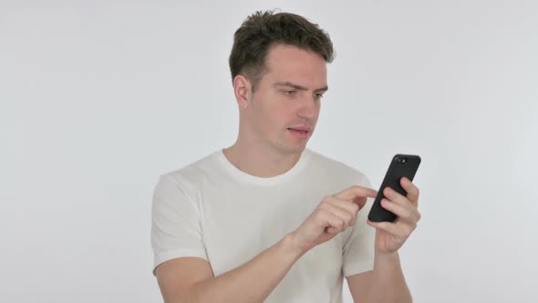 Young Man Loss on Smartphone on White Background