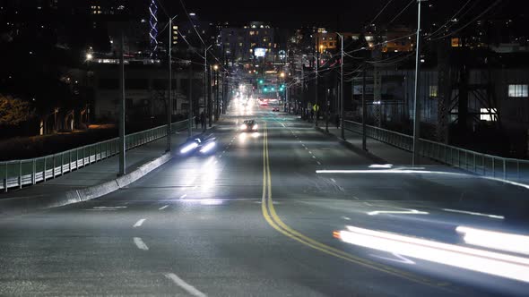 Busy City Street Car Light Streak Trails With Far Vanishing Point Of Focus