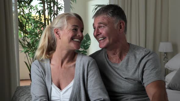 Happy senior couple in bedroom, close up