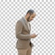 Business man walks in texting on the phone, Alpha Channel - VideoHive Item for Sale