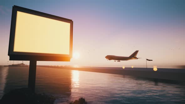The Sunset Time with the Plane Takes Off and the Board of Your Ad 4K alt