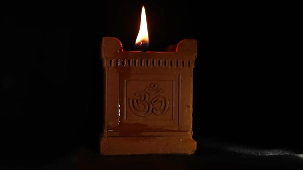 Traditional handmade oil lamp with om symbol