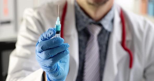 Smiling Virologist Doctor Holds Syringe with Liquid Slow Motion  Movie
