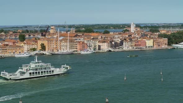 Ferry Sailing Down Venice Canal Water Transportation View of Architecture