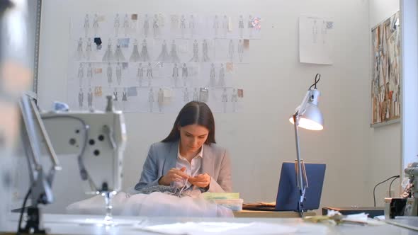 A Young Girl Designer Sewing a Dress in the Studio Dress