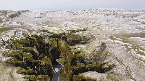 Drone Flight Over Snowy Landscape Of Fjaorargljufur Canyon