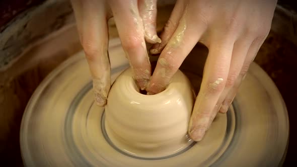 The Sculptor in the Workshop Makes a Jug Out of Earthenware Closeup