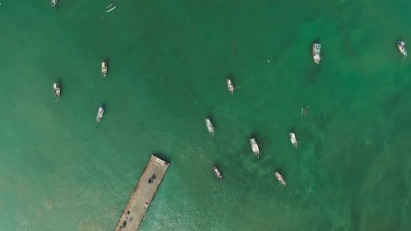 Birdseye Colorful Fishing Boats Off A Cement Pier 2