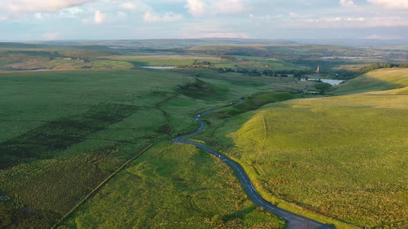 Aerial view of a road winding through English countryside