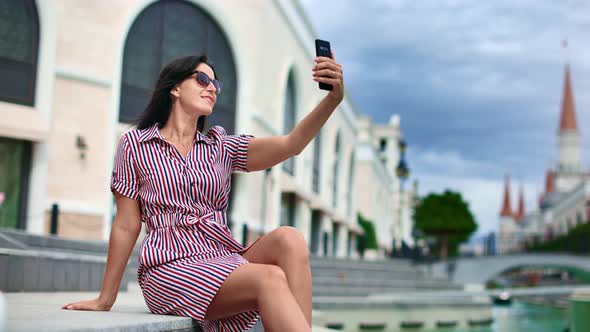 Adorable Lady Smiling Taking Selfie Use Smartphone at European City