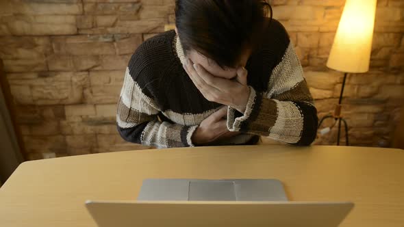 Scared Young Man Looking Terrified While Using Laptop at Home