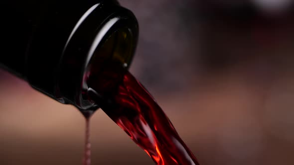 Red Wine Spilling From Bottle