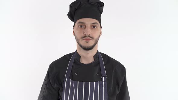 Serious Chef Uniform Walks Close Looking Camera Over White Background