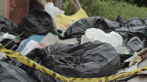 Illegal waste and garbage dumped in countryside close up shot