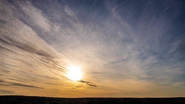 Beautiful Evening Sunset, Time Lapse, Movement of Clouds of a Different Level Against the Setting