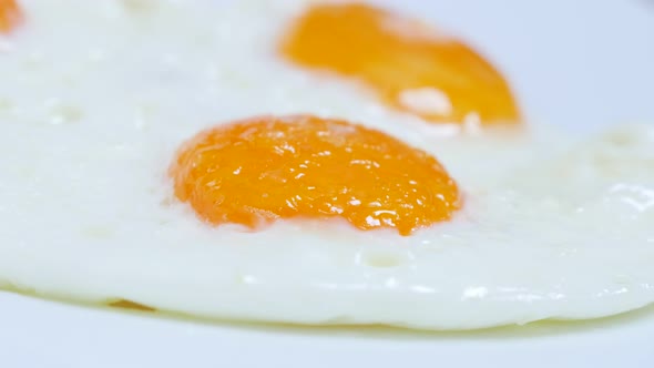 Egg yolk and white fried for tasty breakfast 4K 2160p 30fps UltraHD food footage - Fresh hen eggs fr