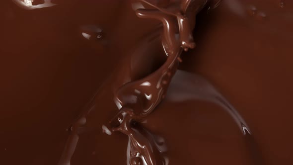 Super Slow Motion Shot of Splashing Melted Chocolate Background at 1000Fps