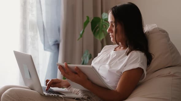 Young Pretty Woman Working on Laptop From Home