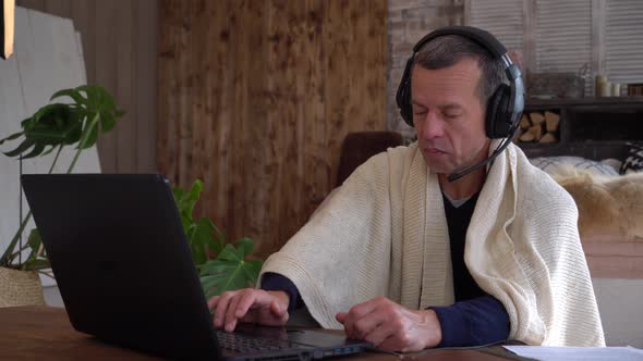 A man tries to work remotely from home during a coronavirus pandemic