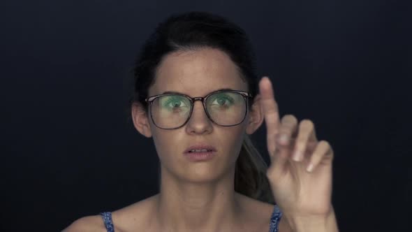 Young woman using touch screen technology