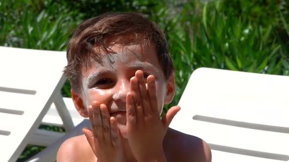 Little Boy Smeared with Sunscreen