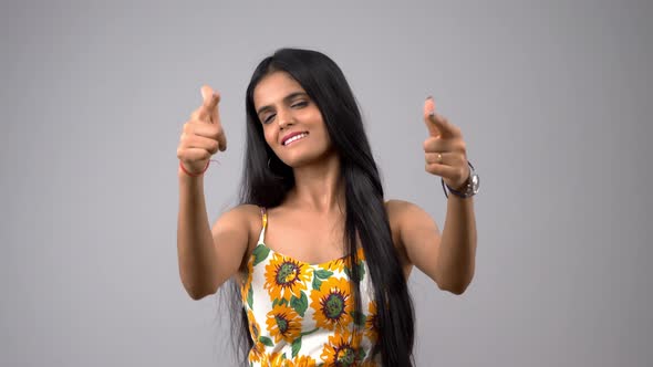 Happy Indian girl showing thumbs up