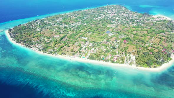 Aerial drone shot scenery of paradise coast beach journey by transparent lagoon with white sand back