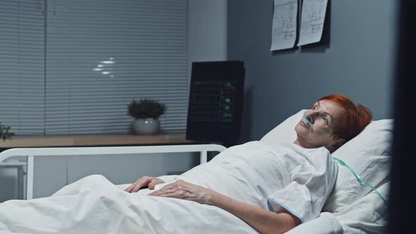 Woman with Oxygen Tube in Clinic