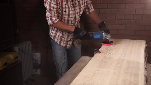 Joiner Is Sanding a Board for Furniture Production
