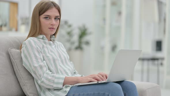 Serious Young Woman with Laptop Saying No with Finger 