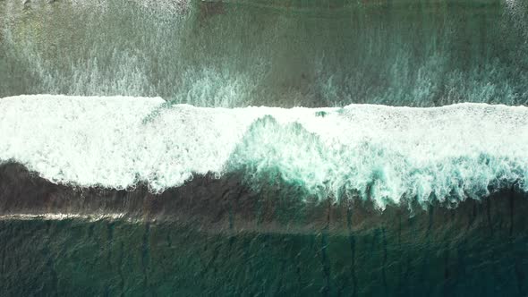 Rough sea waves, dark green stormy ocean background. Aerial slow motion