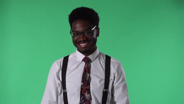 Portrait of Young African American Man Looking at Camera and Smiling Happily Showing White Teeth