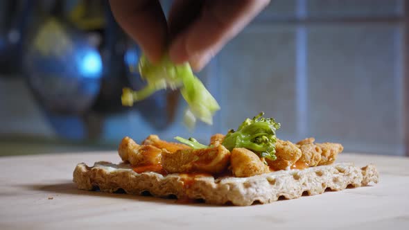 Placing Steamed Broccoli On Top Of Anabolic Toast Sandwich With Cooked Chicken Meat And Red Hot Buff